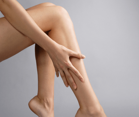 woman showing legs (essential oil for restless legs)