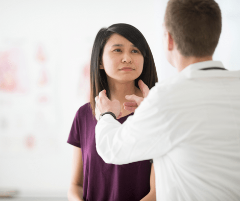 doctor checking lymph nodes