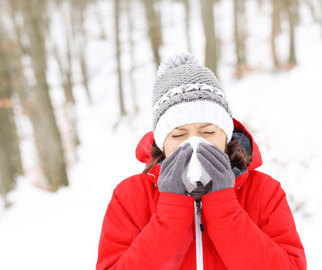 woman with runny nose in winter