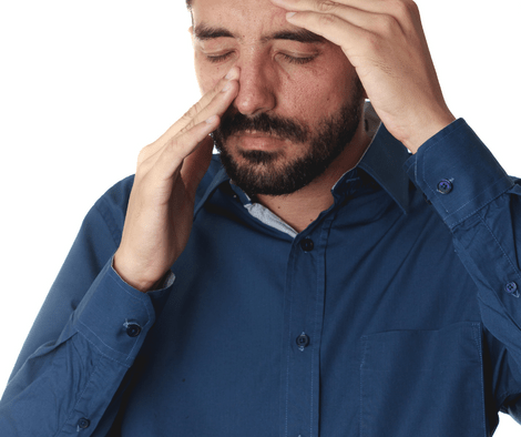 man with headache and sinus pressure